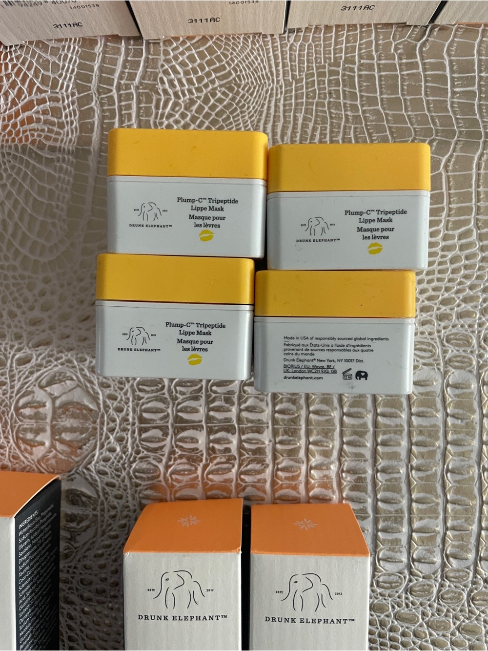 Drunk Elephant Lippe Mask Jars in Bright Yellow and White